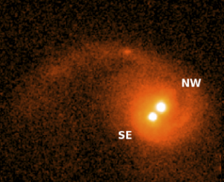 Two (or three?) black holes in one galactic center