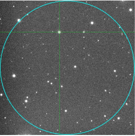 The FRB100703 field. The circle indicates the 14' FRB beam's FWHM, and the cross shows the location of the observed variable star.