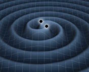 Simulation image of two black holes colliding, with their associated gravitational waves radiating outward