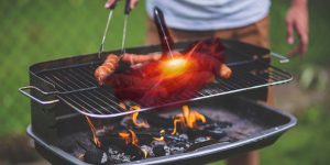 Image of hot dogs on a grill with a semi-transparent overlay of a red quasar on the hot dogs