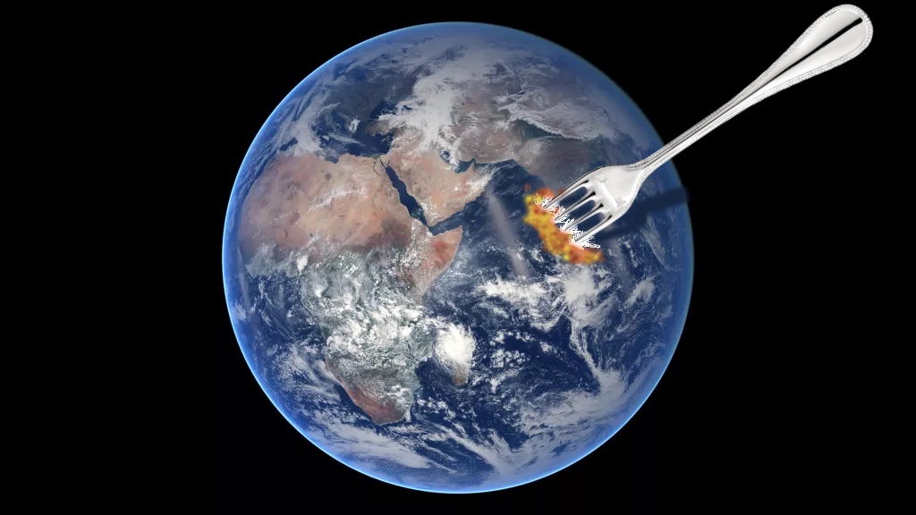 Earth with fork sticking out of it.