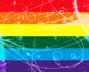 Image of a bubble chamber, with many streaks and tracks from particles, overlaid with a rainbow flag.