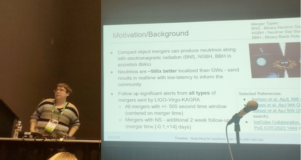a photo of Jessie presenting, with a motivation/background slide from their talk behind them.