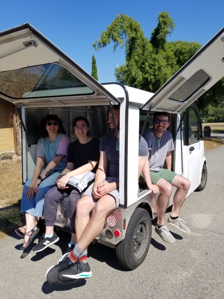 Students sitting in van.