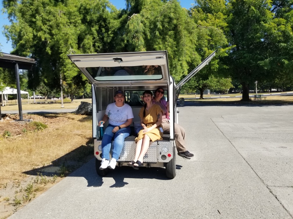 Students sitting in van.