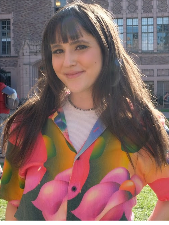A picture showing Samantha wearing a colorful shirt.