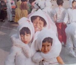 Three children hugging