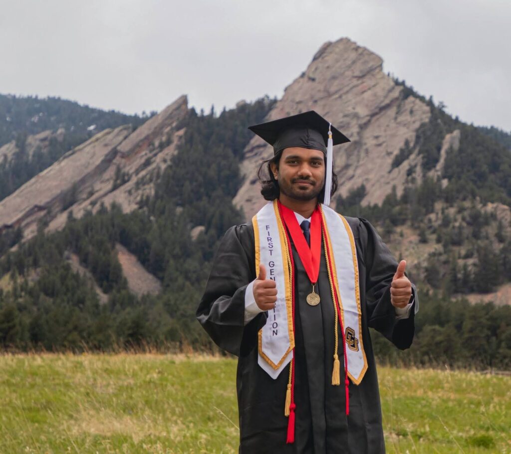 Aman in graduation attire.