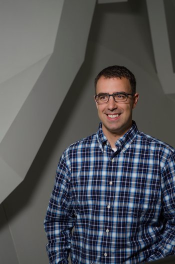 A picture of Professor Dimitri Mawet. He is a white man with short brown hair and square glasses.