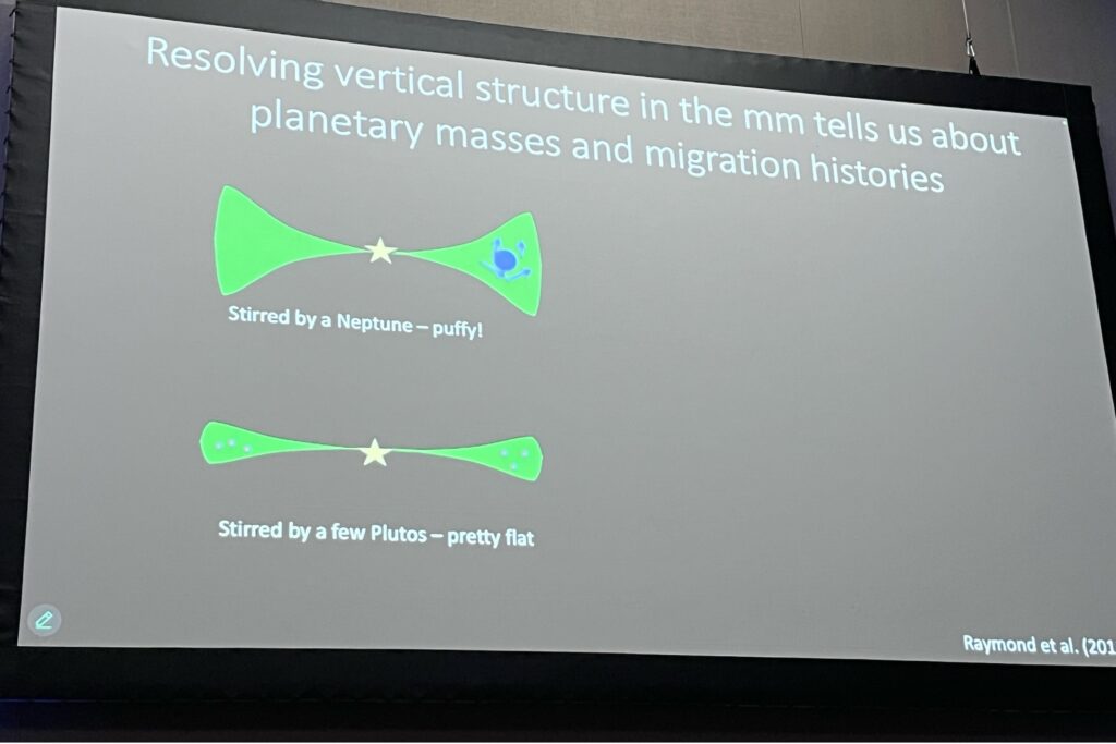 A picture of the slides from Meredith Hughes' presentation. This shows two cartoon illustrations of debris disks with different mass planets in them. The debris disk with a massive planet is more puffy and flared, whereas the disk with a less massive planet is less flared.