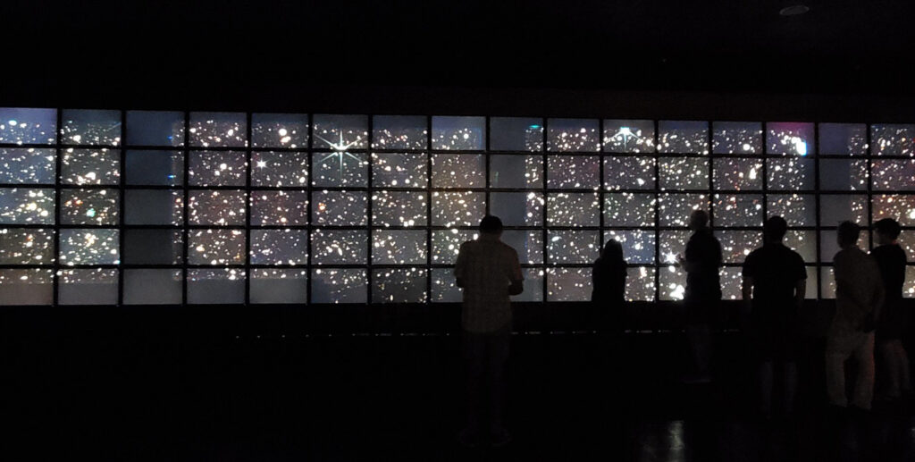 photograph of people looking at CEERS data