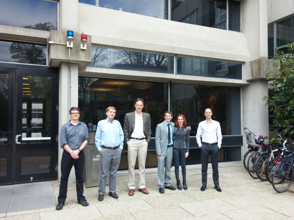 Five men and a woman standing outside the Harvard-Smithsonian Center for Astrophysics.
