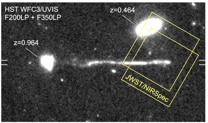 A black and white HST image with two galaxies and a linear structure pointing directly from one of the galaxies. Two yellow squares are overlaid, showing where JWST spectra were taken of the linear structure.